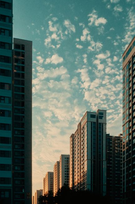 A mesmerizing view of modern skyscrapers silhouetted against a colorful sunset sky.