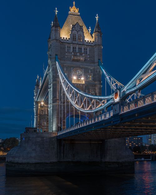 Free Stunning nighttime view of the illuminated Tower Bridge in London, showcasing its majestic architecture. Stock Photo