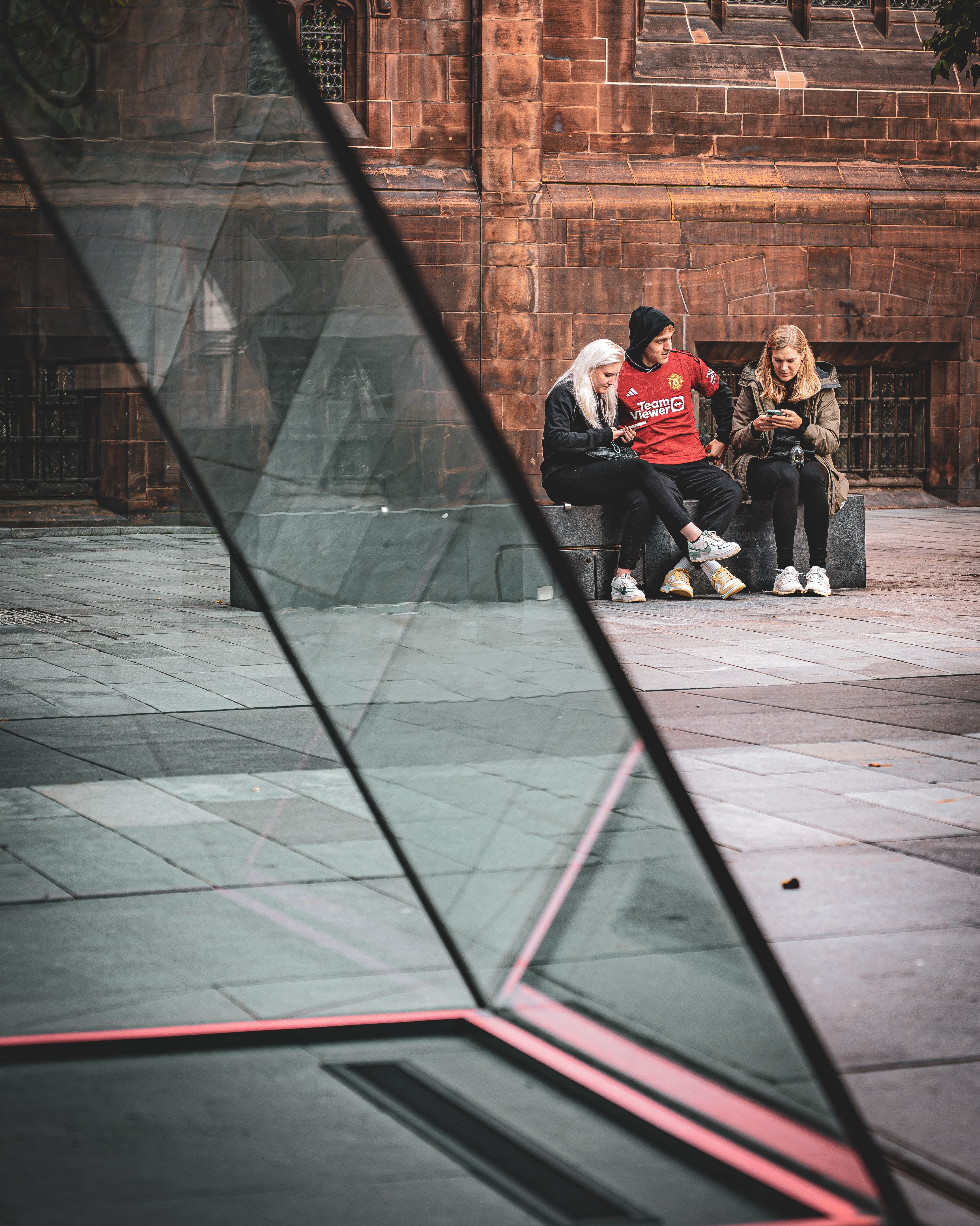 People Sitting on a Bench in the City Center · Free Stock Photo