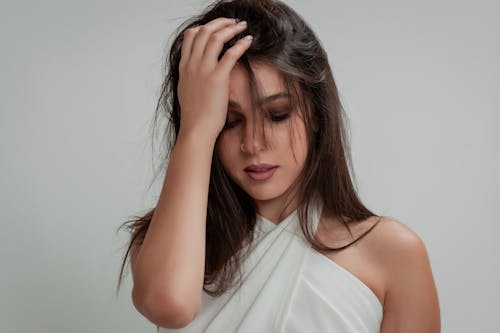 Studio Shoot of a Young Brunette Wearing a White Blouse