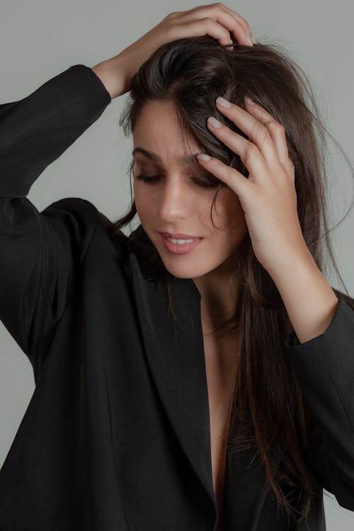 Studio Shoot of a Brunette Wearing a Black Suit