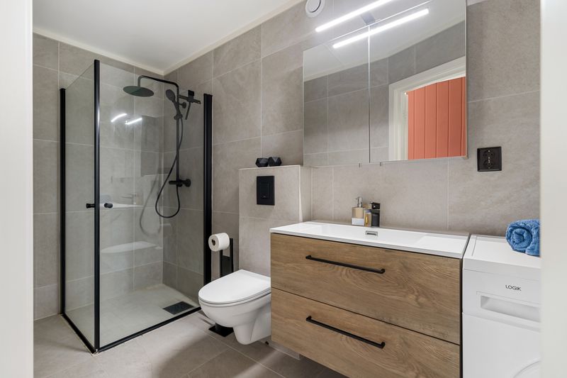 Modern bathroom with wood vanity cabinet