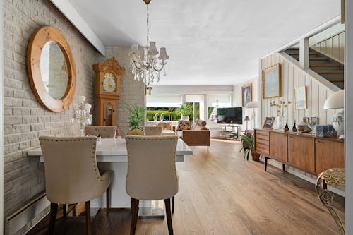 Free View of a Dining Area and a Living Room in a Modern House Stock Photo