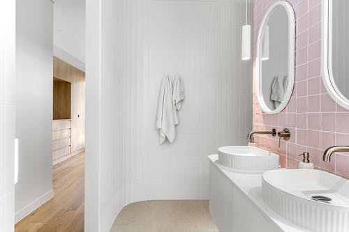 Interior of a Modern Bathroom with White and Pink Tiles 