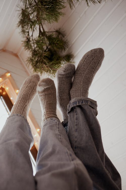 Socks on Legs of People in Jeans