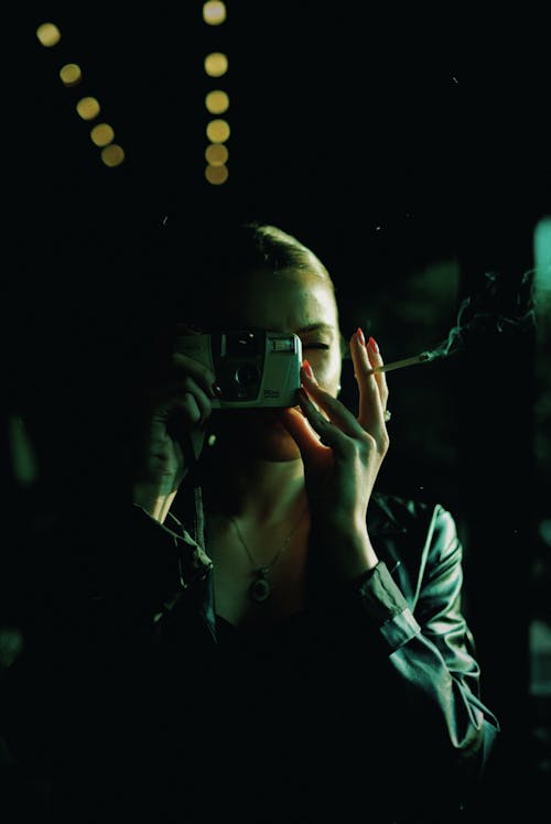 Woman Taking a Picture with a Disposable Camera 