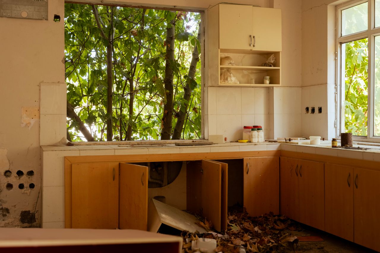 A kitchen with cabinets damaged beyond repair