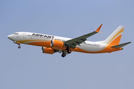 Airplane Flying against a Clear Sky