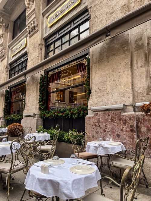 Free Elegant outdoor cafe set against a historic building facade in Istanbul, capturing urban charm. Stock Photo