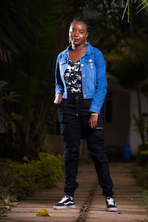 Model in a Denim Jacket and a Blouse with Palm Trees Blouse