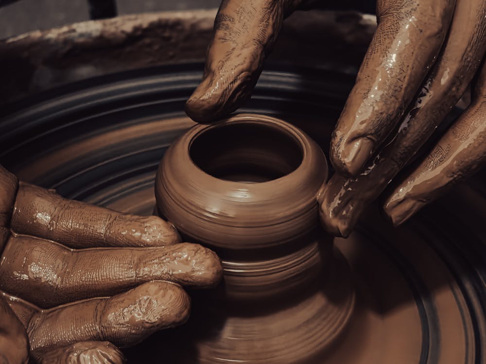 Man Making Clay Pottery