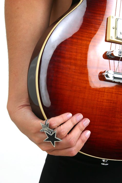 Woman Hand Holding Guitar