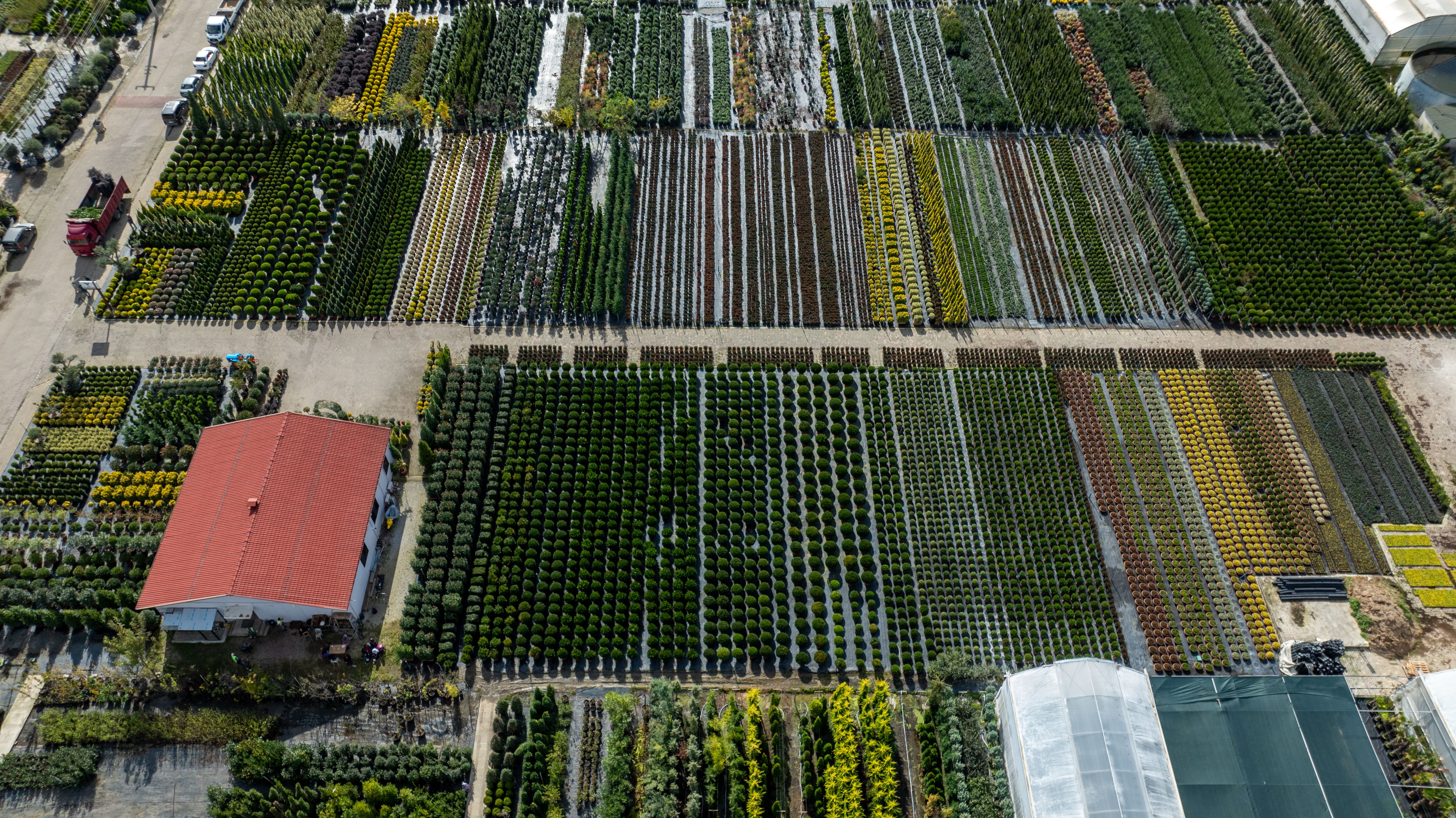 Drone shot capturing diverse agricultural fields in Yalova, Türkiye. Symmetrical layout of cropland from above.