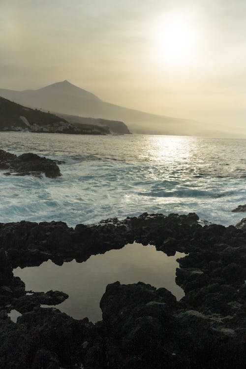 Rocks on Sea Shore at Sunset