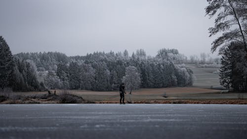 Man Skating on Frozen Lake