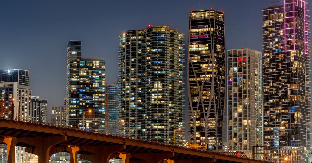 Captivating view of Miami's illuminated skyline and skyscrapers at night.