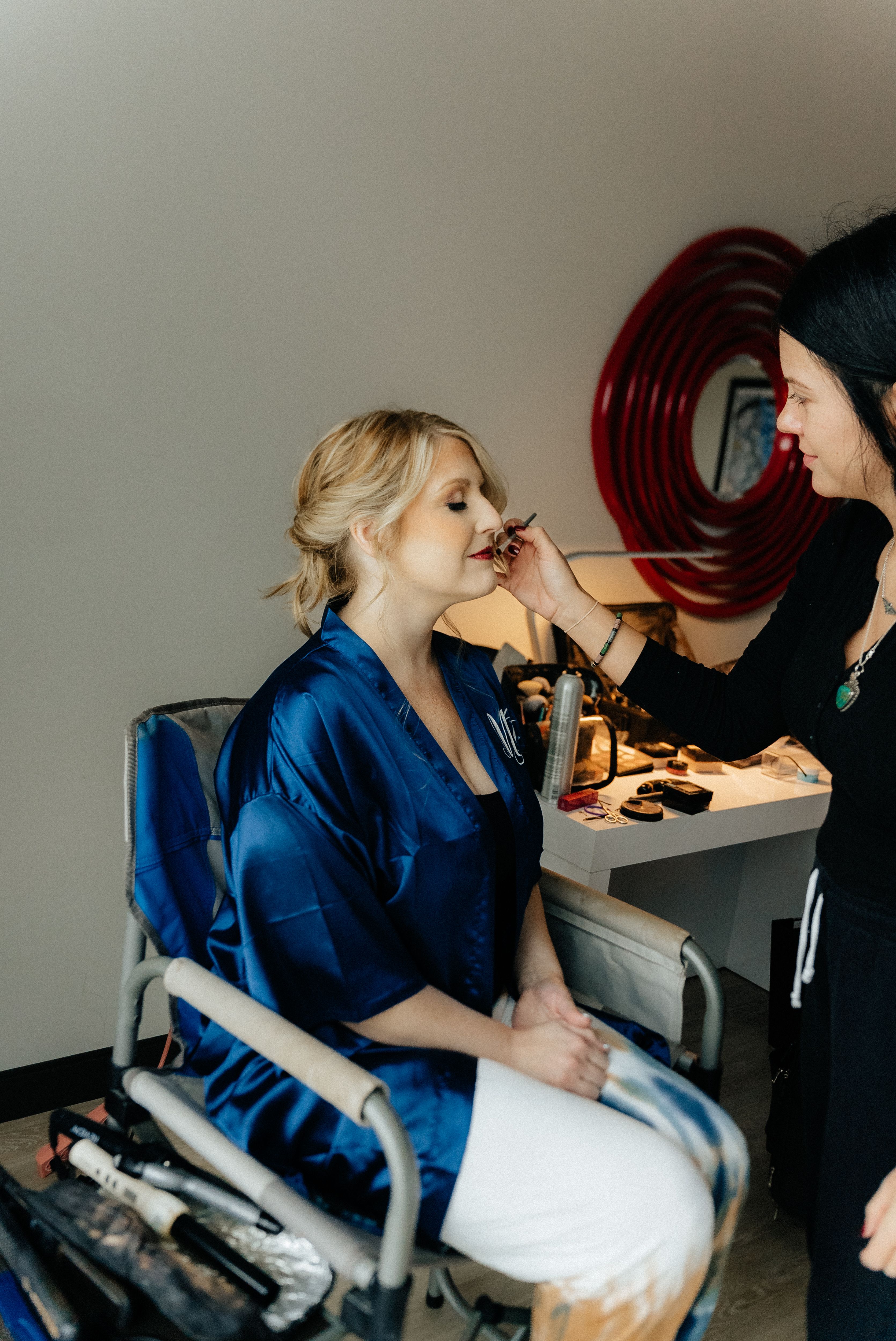 Woman in Blue Robe Getting her Makeup Done · Free Stock Photo