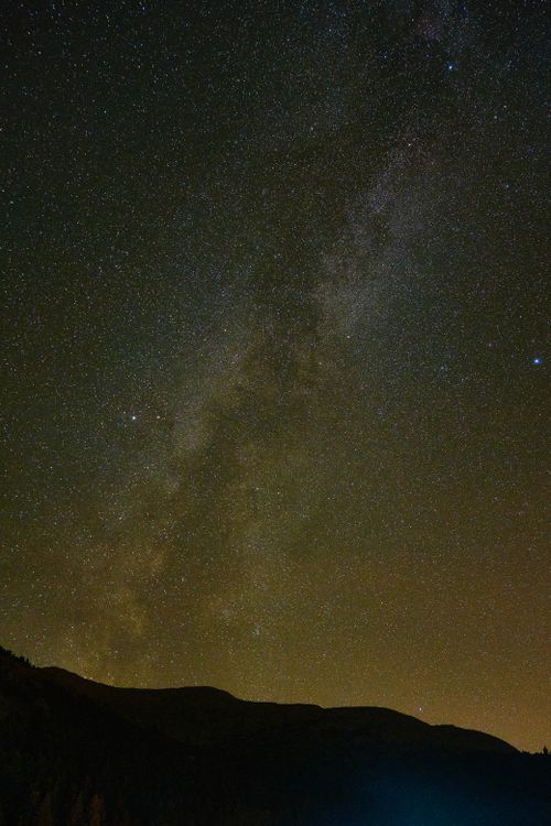 Free A breathtaking view of a star-filled night sky featuring the Milky Way galaxy. Stock Photo