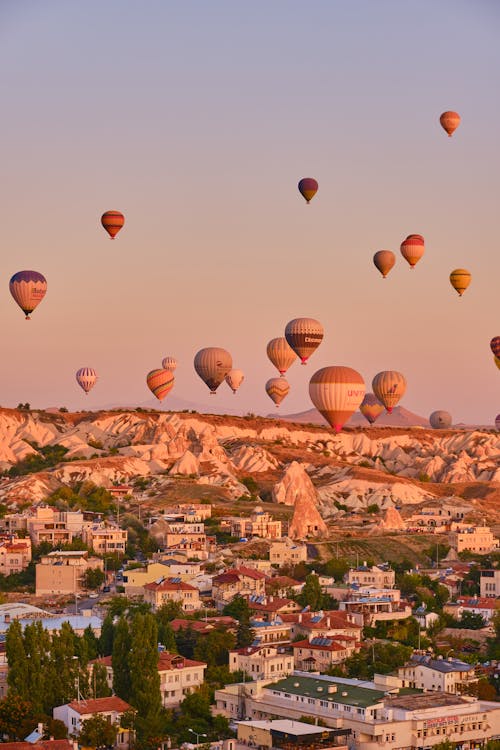View of Hot Air Balloons Flying over Cappadocia at Sunset