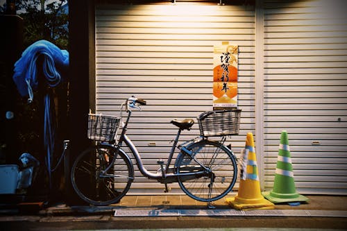 Bike Next To Yellow and Green Traffic Cones