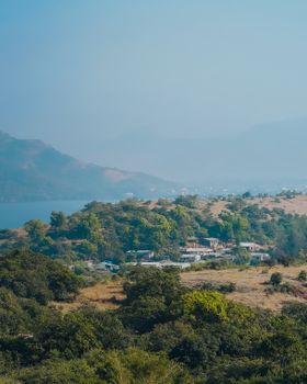 Aerial view of Lonavala, India showcasing lush greenery and rural village setting.