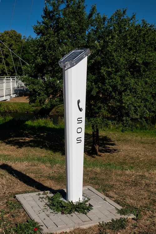 SOS Post on Grass · Free Stock Photo