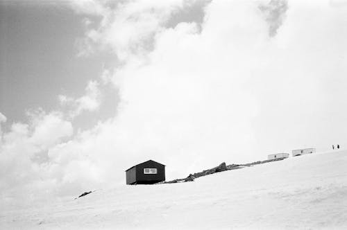 Wooden House on Hill in Winter