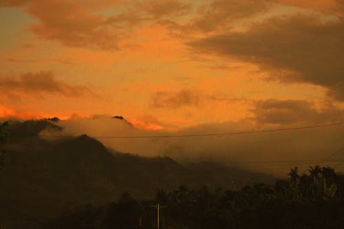Free stock photo of brown mountains, golden sunset, orange skies