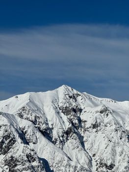 Majestic snow-covered mountain peak in Takayama, Gifu, Japan, showcasing winter serenity.