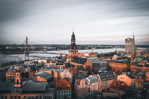 Explore the stunning architecture and skyline of Riga, Latvia during a picturesque sunset.