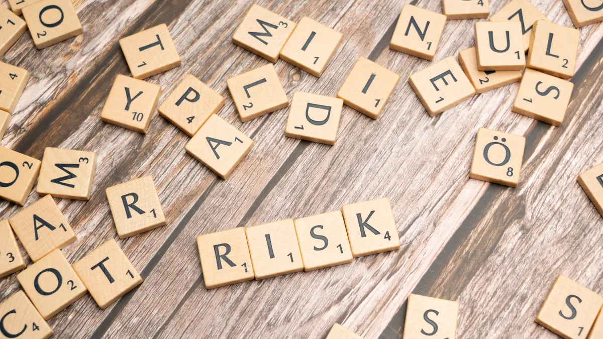 What are the risks of fully automated AI blog content? What are the risks of fully automated AI blog content? — Scrabble letters spelling risk on a wooden table