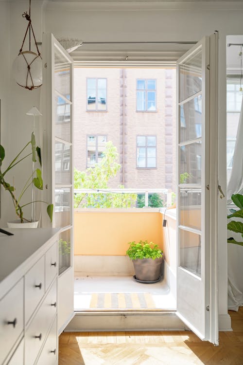 Free Open Door with a View of a Balcony  Stock Photo