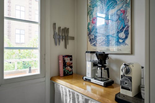 Free Coffee Machine on Wooden Counter in Kitchen Stock Photo