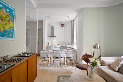 Bright Scandinavian-style dining room with modern furniture and decor.