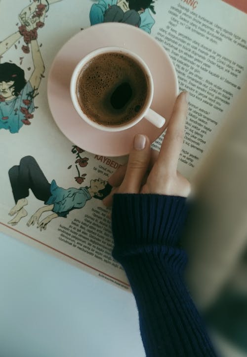 Woman Hand Holding Cup of Coffee