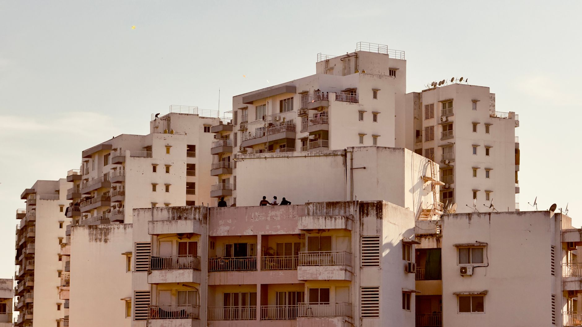 Residential buildings in Ahmedabad, India, captured at dusk showcasing urban living.