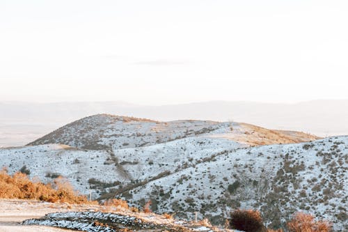 Snow on Hills in Countryside