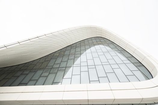 Explore the sleek, modern curves of the Heydar Aliyev Center in Baku, Azerbaijan.