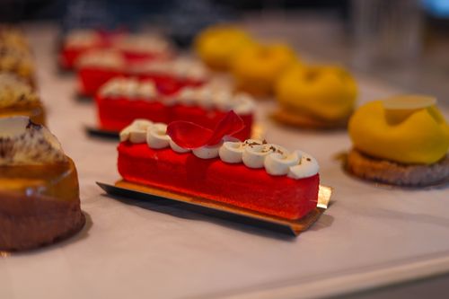 Free Indulge in a colorful variety of delicious pastries, beautifully arranged for food photography enthusiasts. Stock Photo