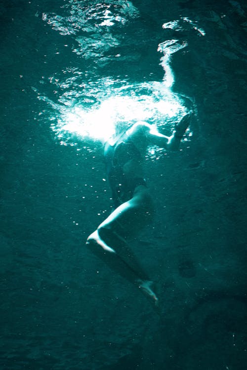 Woman Diving in Water