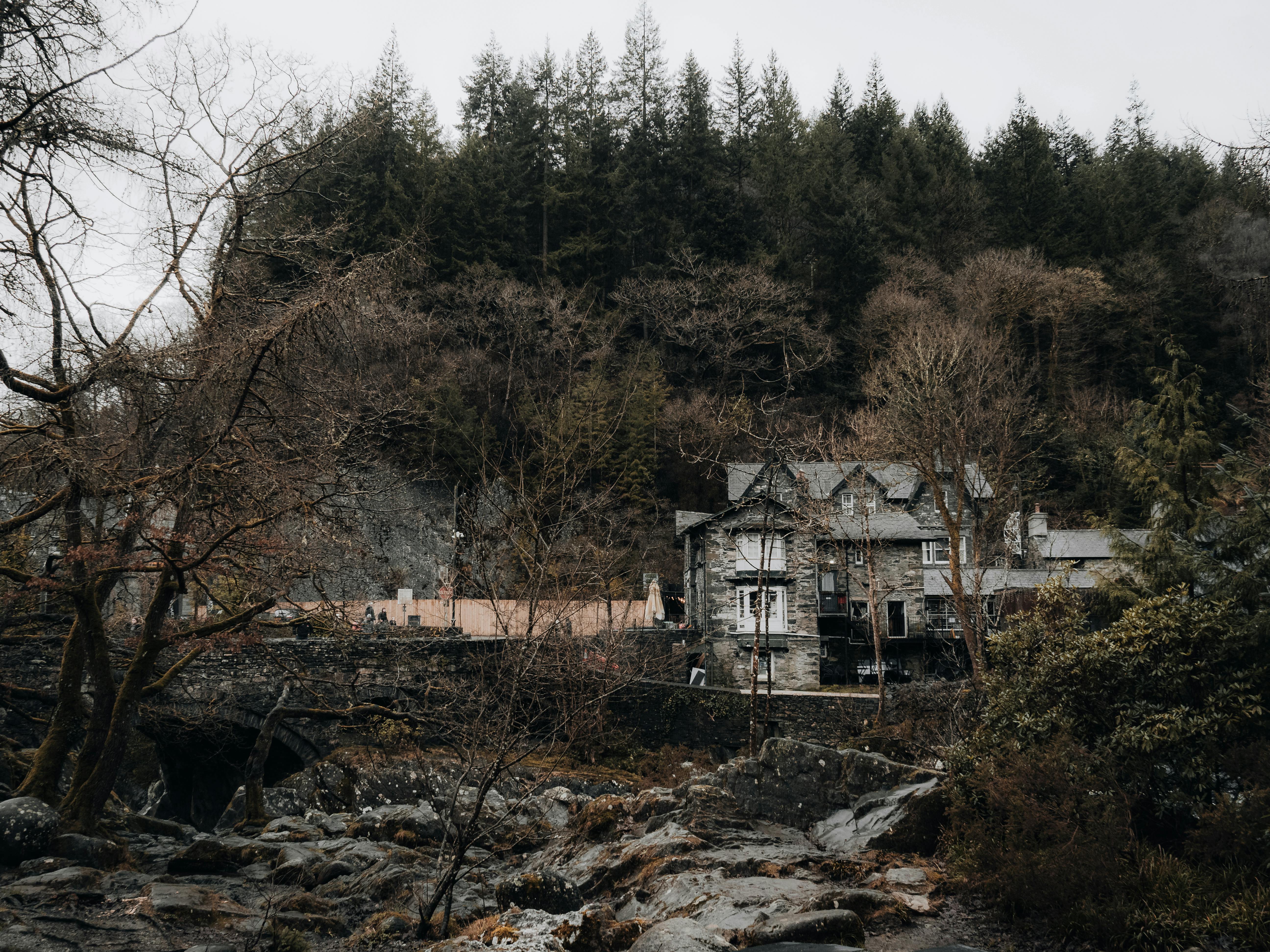 Rustic house nestled in the forests of Betws-y-Coed, Wales, surrounded by natural beauty.