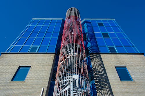 Low Angle Shot of a Modern Building with a Spiral Staircase 