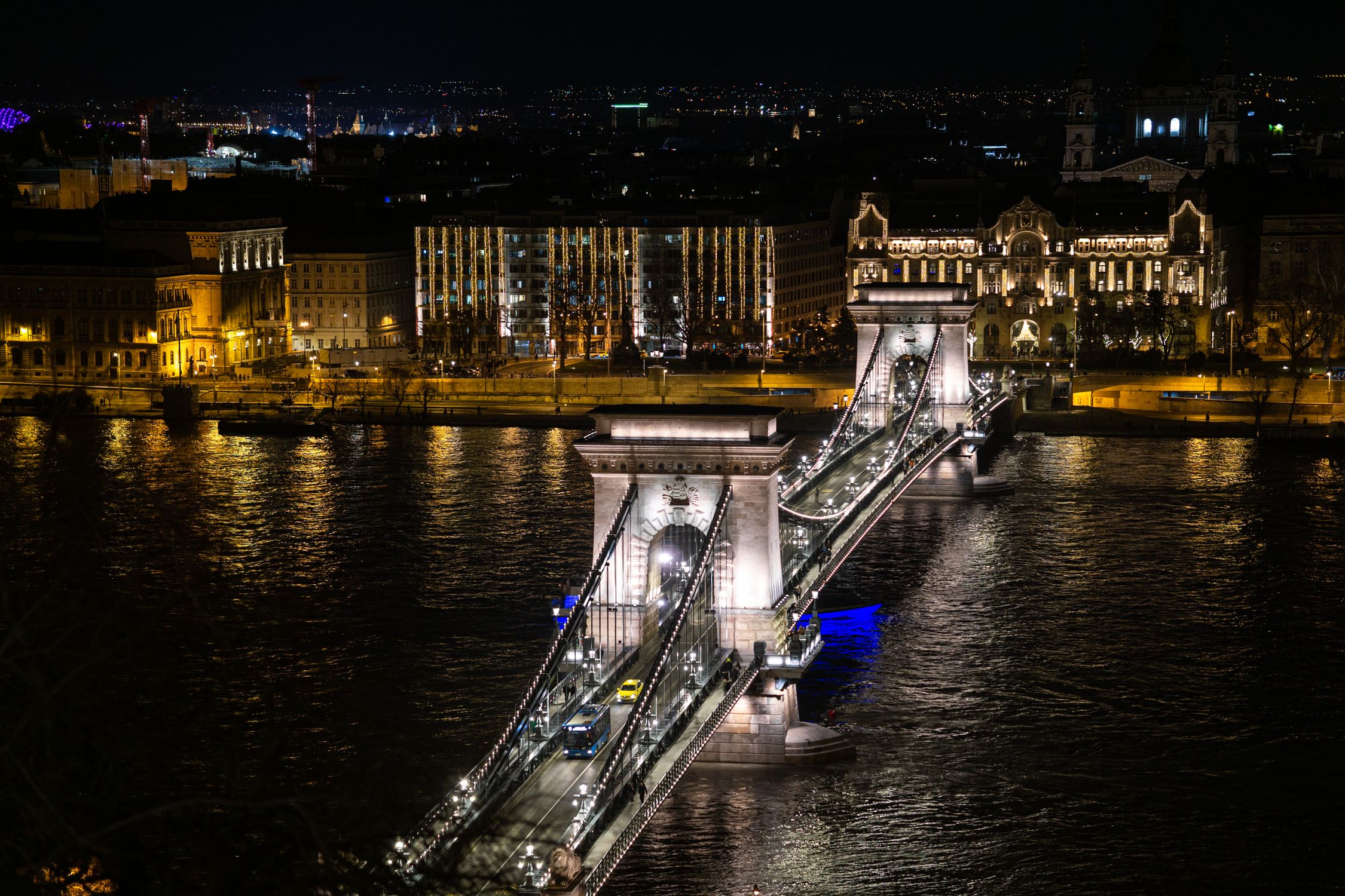 Aerial View Of Illuminated Szechenyi Chain Bridge Over The River Danube aerial-view-of-illuminated-szechenyi-chain-bridge-over-the-river-danube