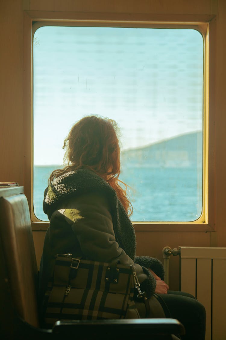 Woman Looking In Ferry Window