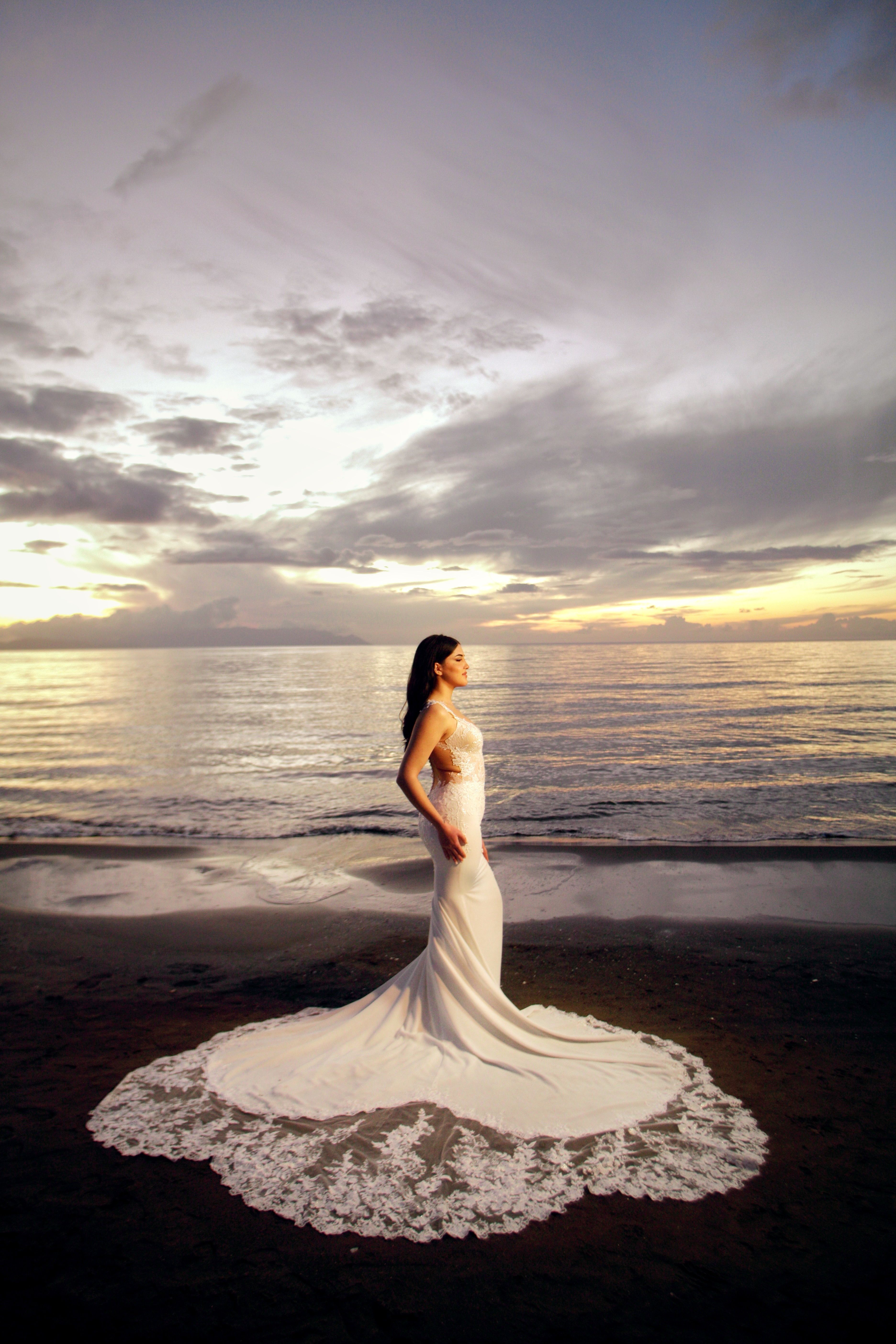 Woman in Maxi Dress Standing on Beach · Free Stock Photo
