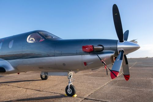 Free Elegant small aircraft with propeller parked on Sylt runway under clear skies. Stock Photo