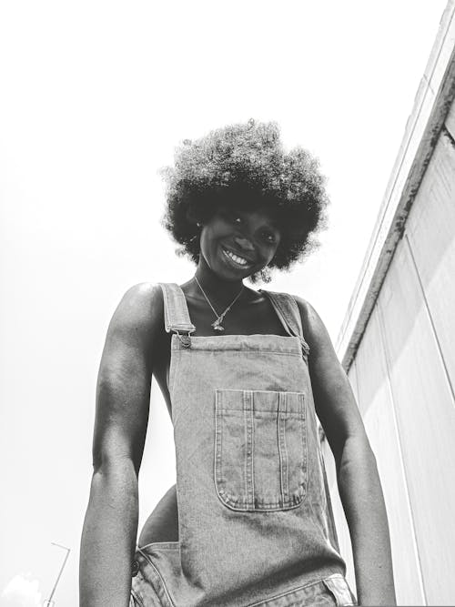 Smiling Woman in Jean Overalls