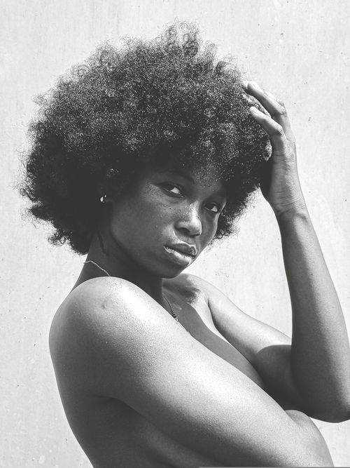 Free Striking black and white portrait of an African American woman with natural afro hairstyle. Stock Photo