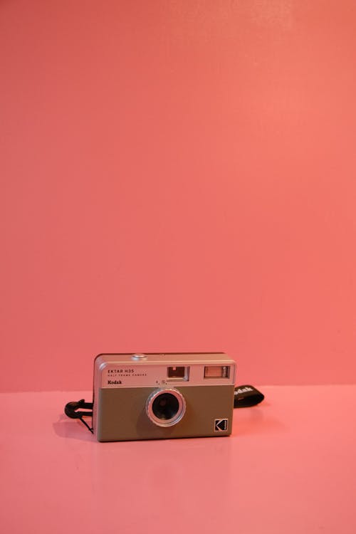 Polaroid Camera on Pink Background