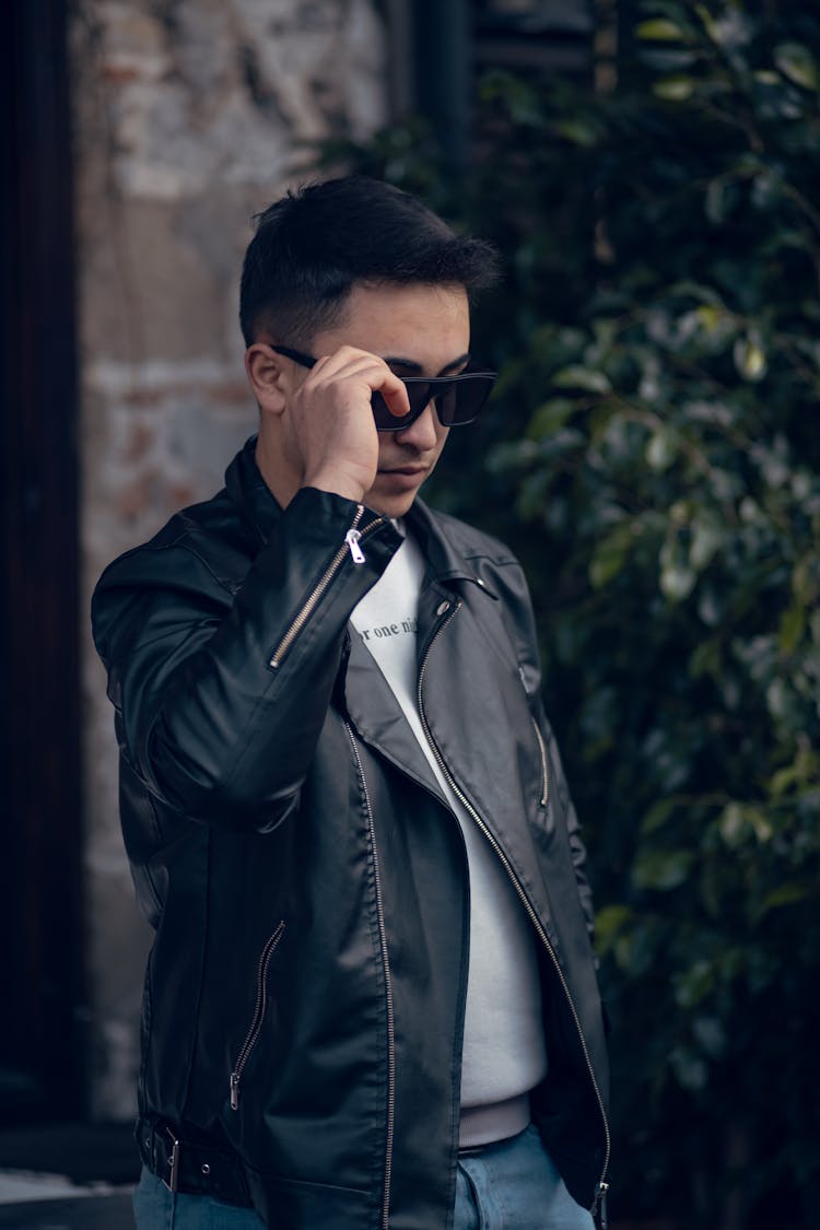 Portrait Of Man Wearing Sunglasses And Leather Jacket 